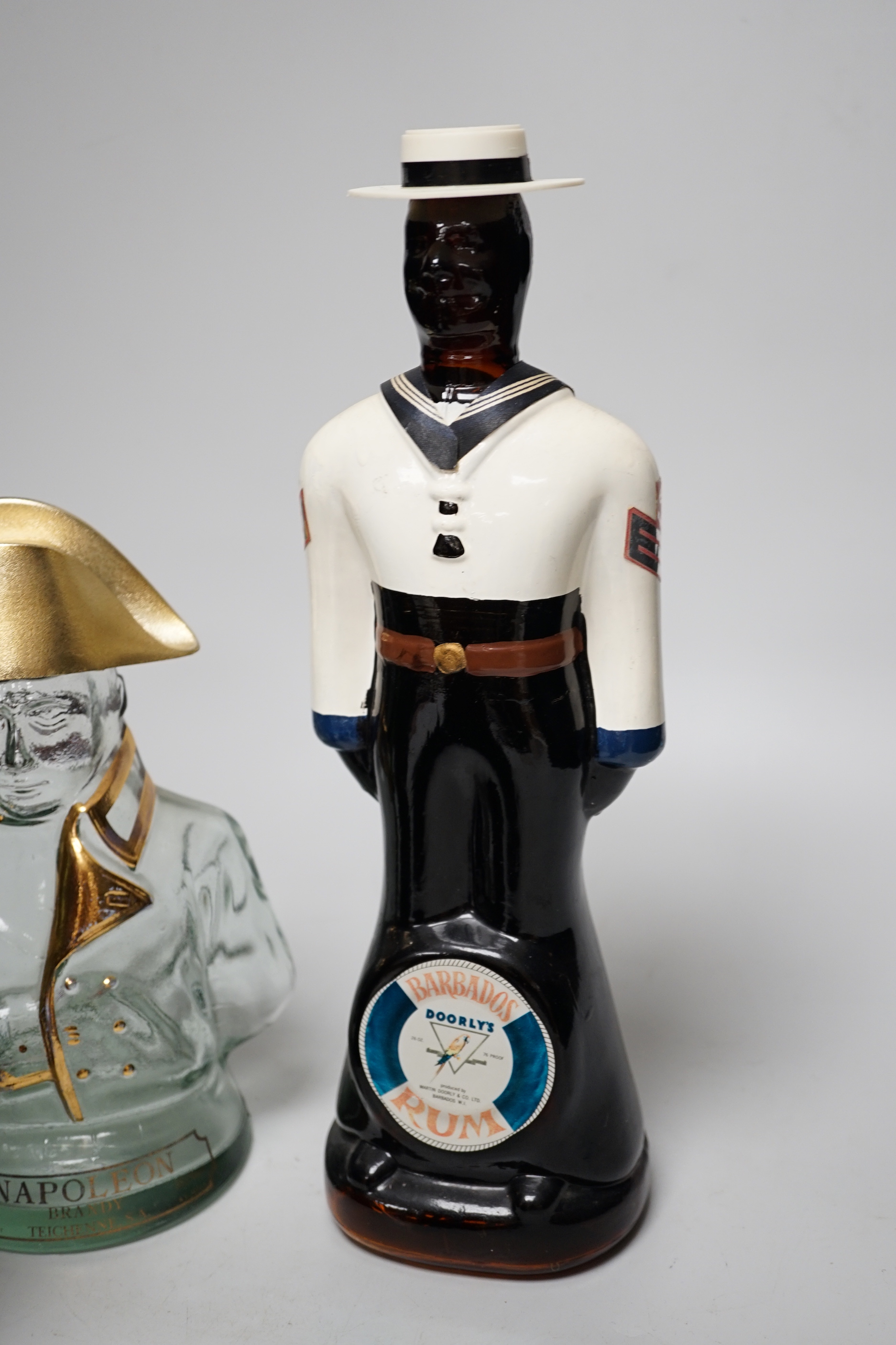 Five novelty empty flasks including Napoleon brandy and Cossack vodka